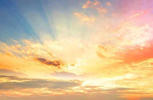 sunshine coming through clouds in sky
